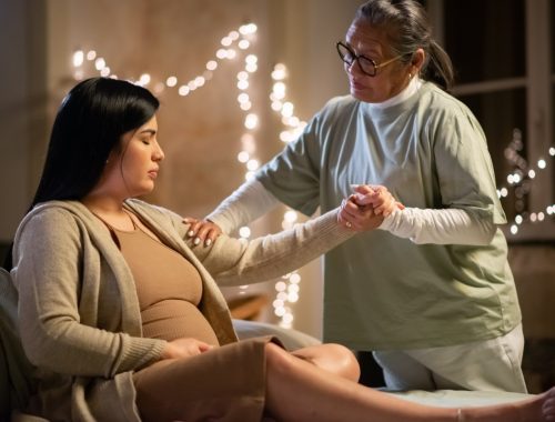 side-view-pregnant-woman-midwife-home-woman-casual-clothes-sitting-bed-asian-doula-holding-hand-pregnancy-medicine-home-birth-concept_edited